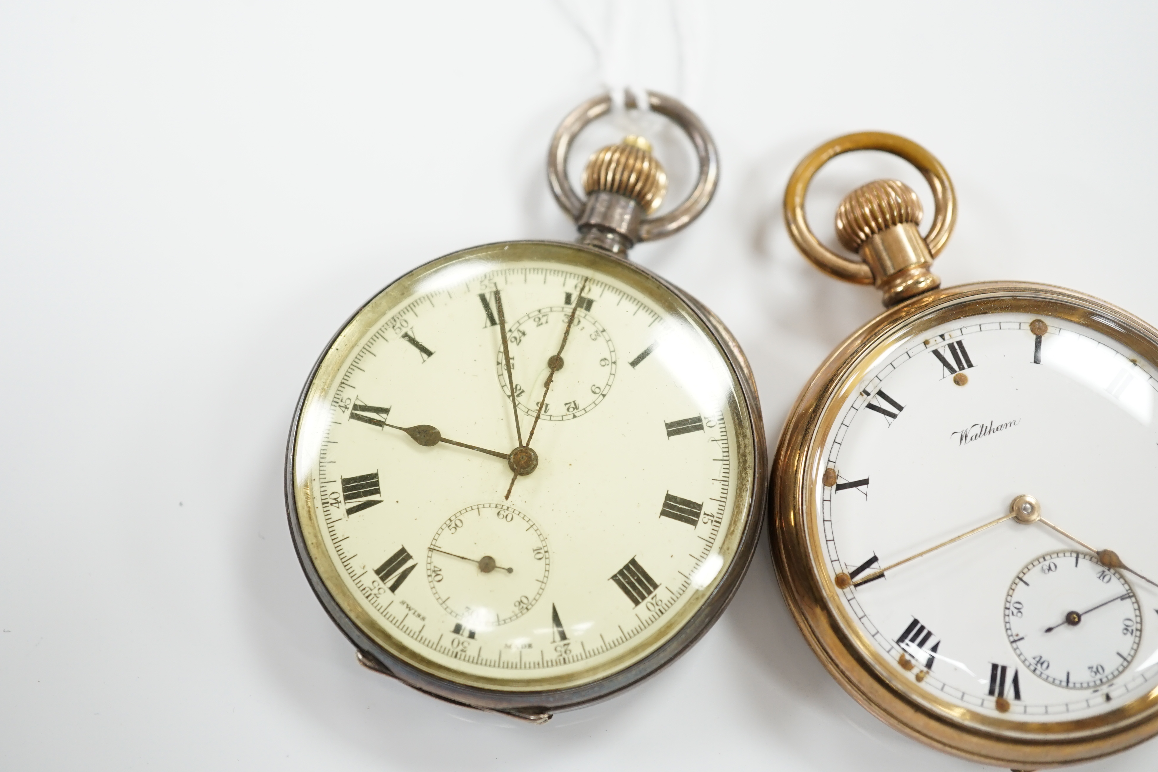 A Swiss 935 white metal open faced keyless pocket watch and a Waltham gold plated pocket watch.